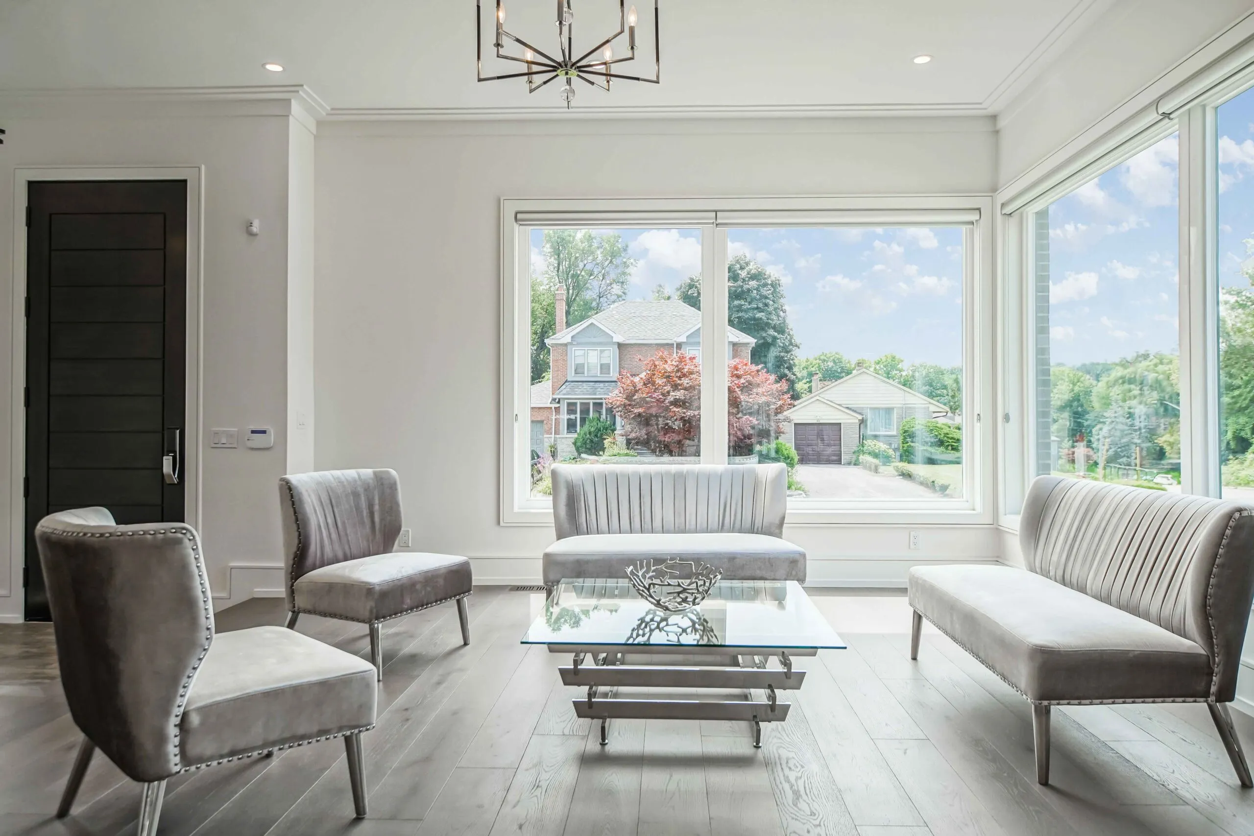Completed Barrie living space with large white-framed replacement windows
