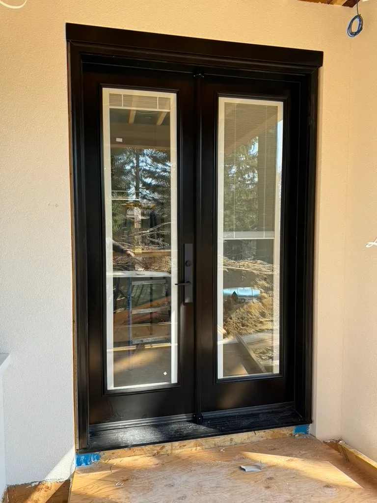 Black double entry doors with tall glass inserts