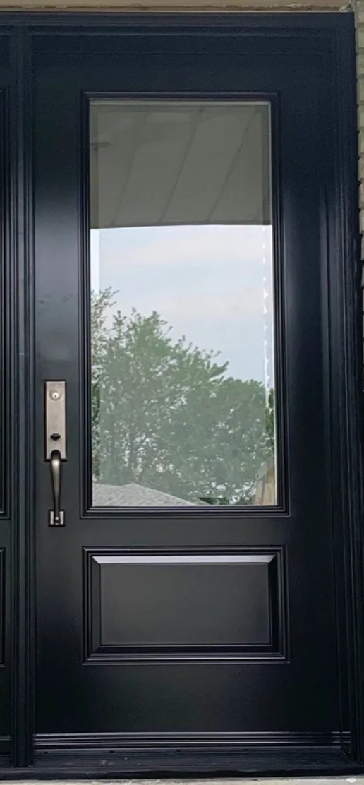 Black entry door with a broad rectangular glass panel