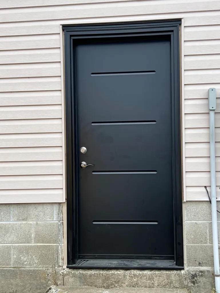 Black entry door with four narrow horizontal details
