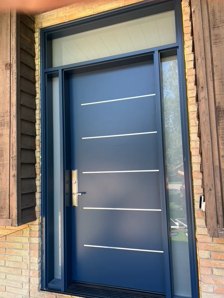 Blue entry door with narrow horizontal metal details