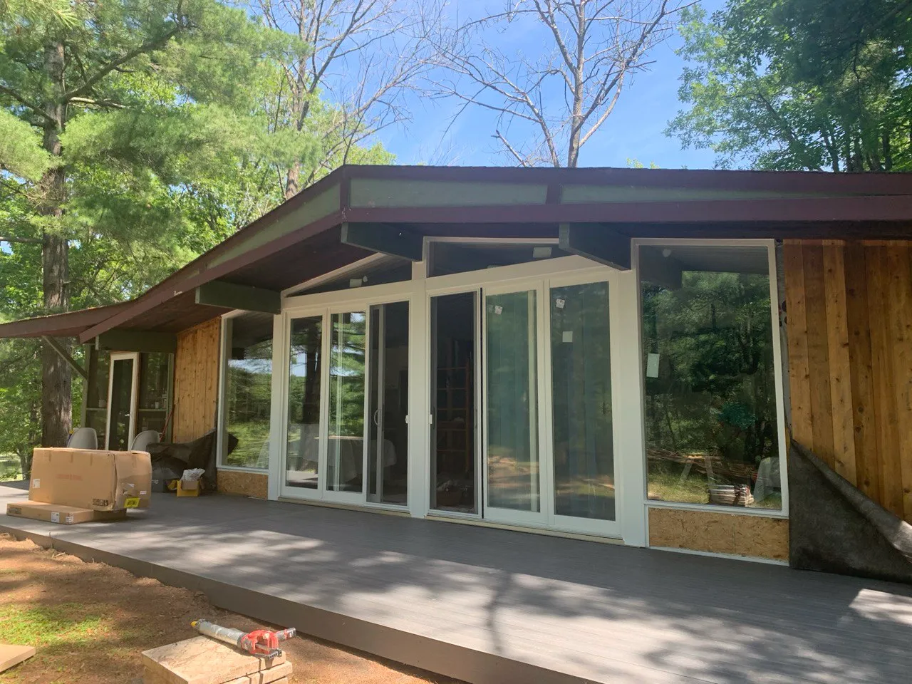 Large multi-panel glazed door wall on a covered patio