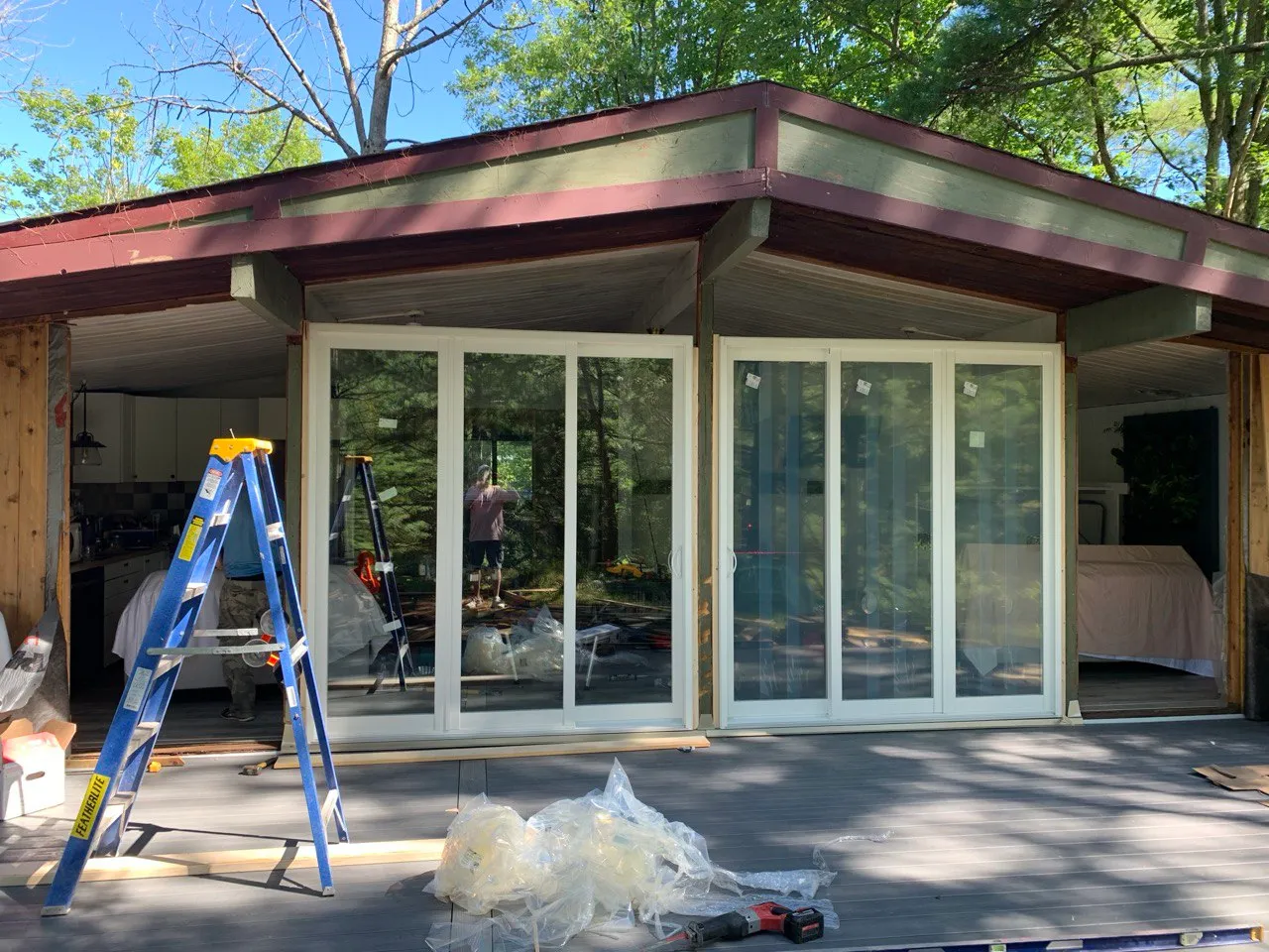Large multi-panel glazed door wall during installation