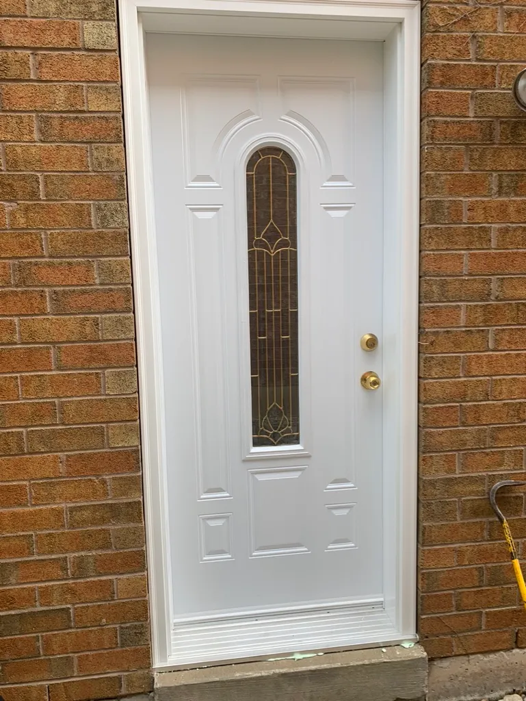 White entry door with a narrow decorative glass insert