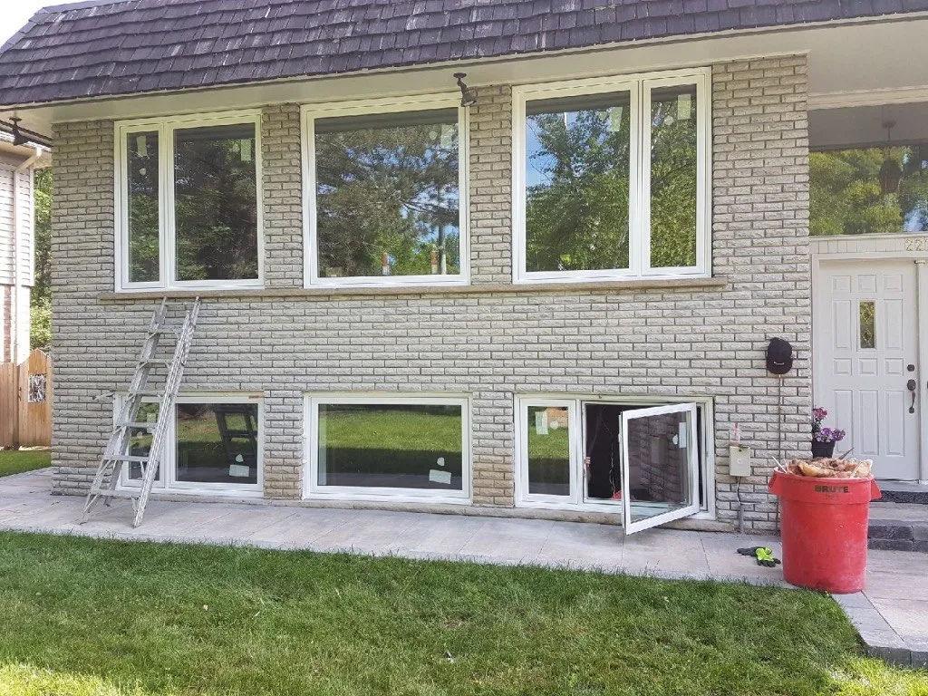 Rear brick house elevation with white-framed windows