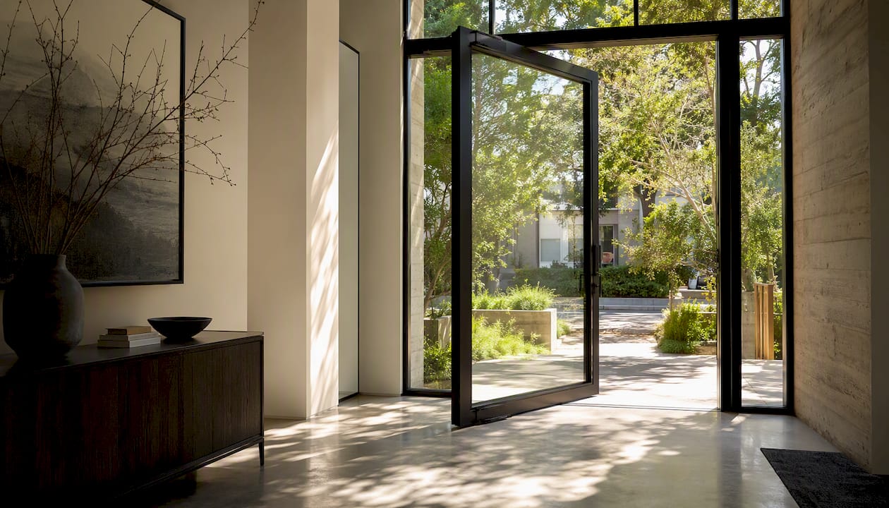 Interior featuring a pivot door in a home foyer